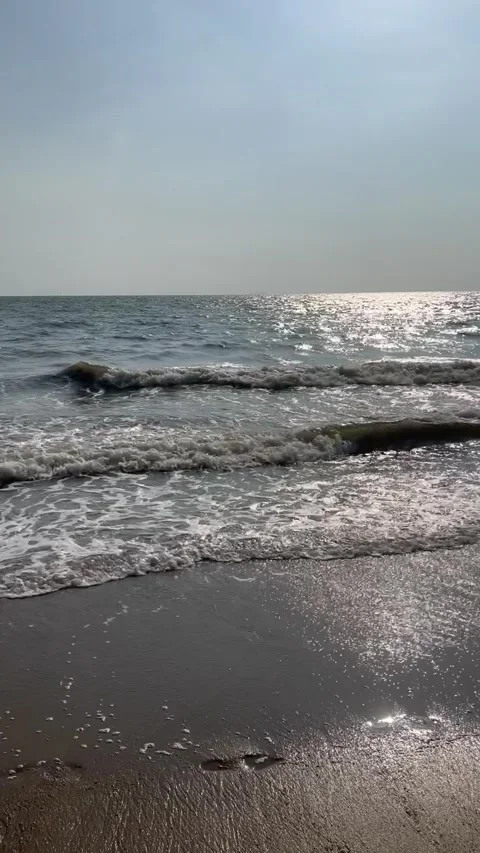 Waves on the beach on a sunny day Stock Footage 237228150