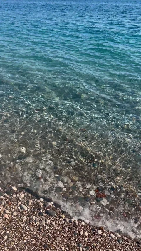Waves on the beach on a sunny day Stock Footage 237235309