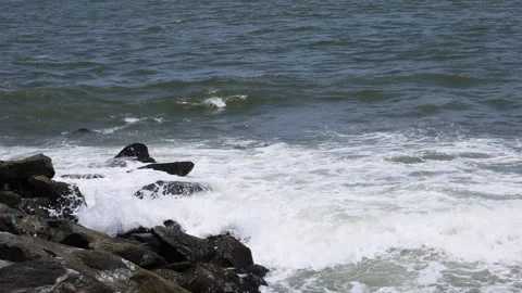 Waves in beach on sunny day Stock Footage 292618477