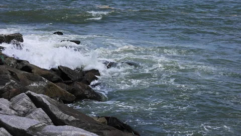 Waves in beach on sunny day Stock Footage 292618617