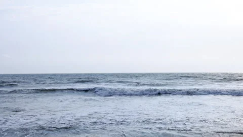 Waves in beach on sunny day Stock Footage 293039070