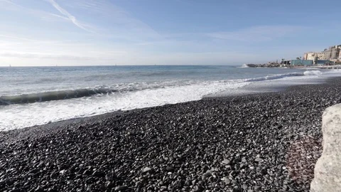 Waves on the beach on a sunny day towards Genoa Stock Footage 103437487