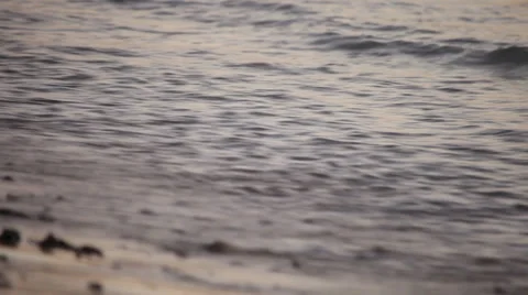Waves on a beach before sunrise - closeup Stock Footage 37810511