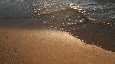 Waves on beach with sunset close up 動画素材 955164