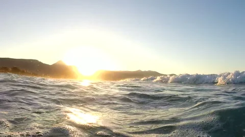 Waves on a beach at sunset Stock Footage 48718595