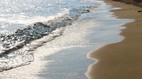 Waves on the beach. Sunset. Golden sand. Stock Footage 93304294