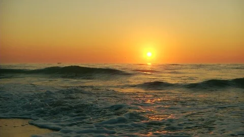 Waves on a beach with Sunset or sunrise Stock Footage 111287859