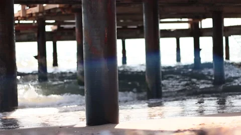 Waves on the Beach under the bredge Stock Footage 184028866