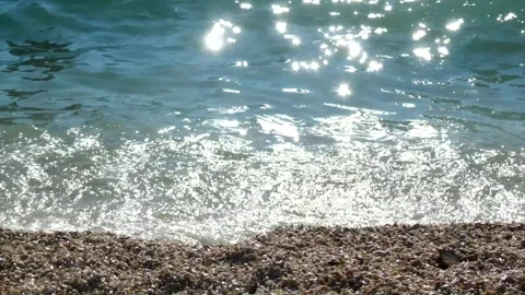 Waves on a beach with very beautiful shining light reflection on water. Stock Footage 271626242