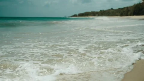 Waves on the beach of white sand close-up Video stock 251577305