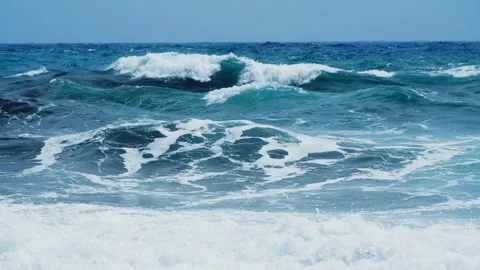 Waves on the beach in windy day. Blue sea and the blue sky. Stock Footage 243115698