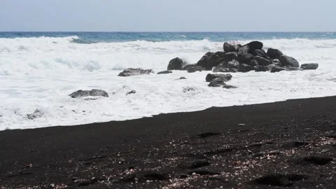 Waves on the beach in windy day. Perissa beach in Santorini island, Greece. Stock Footage 244107701