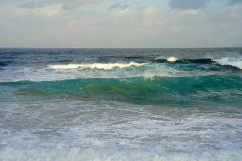 Waves on the beach in windy weather Stock Photos