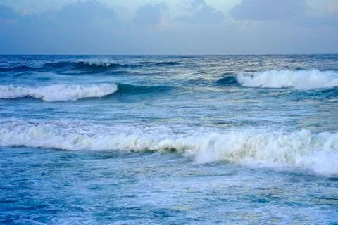Waves on the beach in windy weather Stock Photos