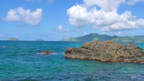 Waves beat against big rocks in the ocean with clear water. Concept of nature. 스톡 동영상 134048200
