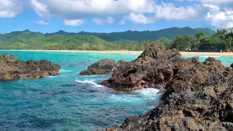 Waves beat against big rocks in the ocean with clear water. Concept of nature. Stock-Footage 134049114