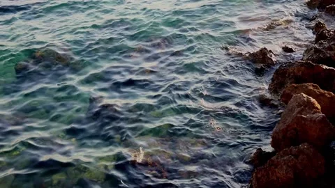 Waves beat against the coastal stone Stock Footage 218474839