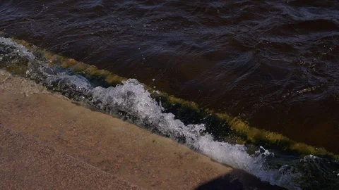 Waves beat against granite steps on the Neva embankment. Stock Footage 121004331