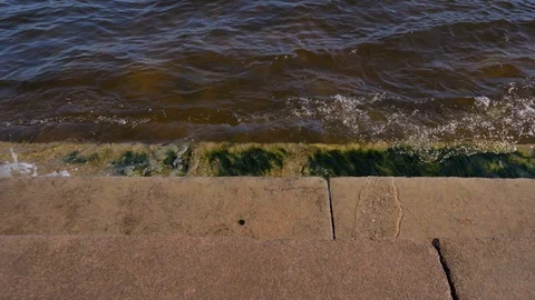 Waves beat against granite steps on the Neva embankment. Stock Footage 121004489