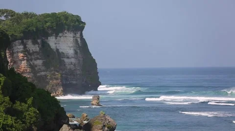 The waves beat against the rock, Beach Uluwatu, Bali, Indonesia. Stock Footage 66579538