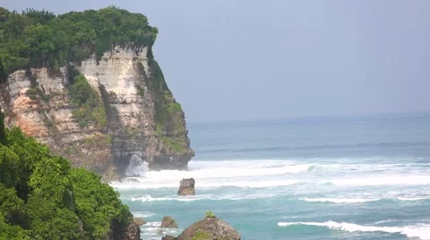 The waves beat against the rock, Beach Uluwatu, Bali, Indonesia. Stock Footage 66588927