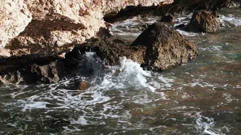 The waves beat against the rocks on the seashore Stock Footage 105686328