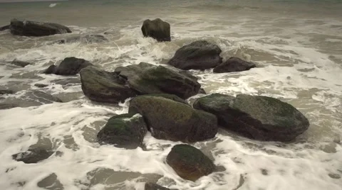 The waves beat against the rocks. Slow motion. Stock Footage 52669796