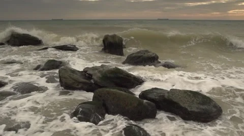 The waves beat against the rocks. Slow motion. Stock Footage 52669874
