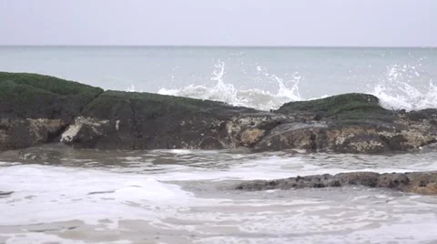 The waves beat against the rocks. Slow motion. Stock Footage 53086461