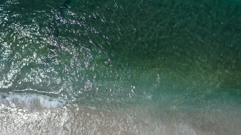 Waves beat against the sandy coast of alanya Stock Footage 156951357