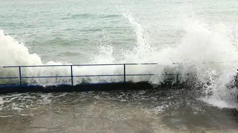 Waves beat against the shore Stock Footage 12476175