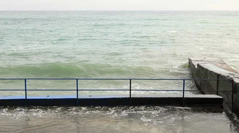 Waves beat against the shore Stock Footage 32271962