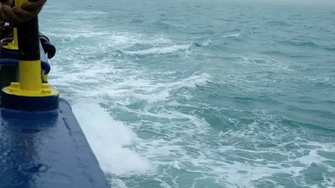 The waves beat against the side of the running ship Stock Footage 79811413