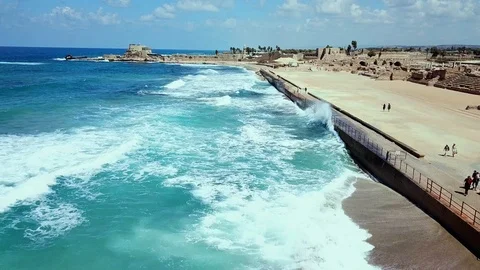 The waves beat against the wall of the old city of Caesarea Video stock 100713225