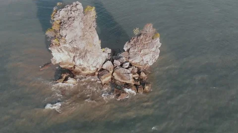 The waves beat on a rock in Malacca Strait Stock Footage 106825031