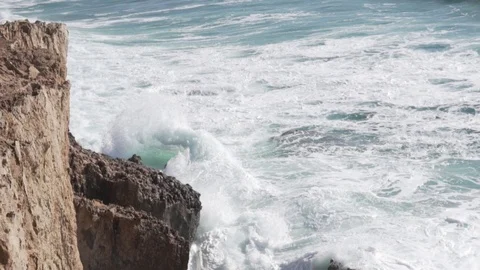 Waves beat on the rocks. View from a cliff above the sea Stock Footage 106359488