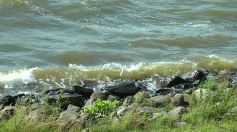 The waves beating against the coastal rocks Stock Footage 65465968