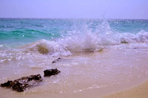 Waves beating against the shore Stock Photos