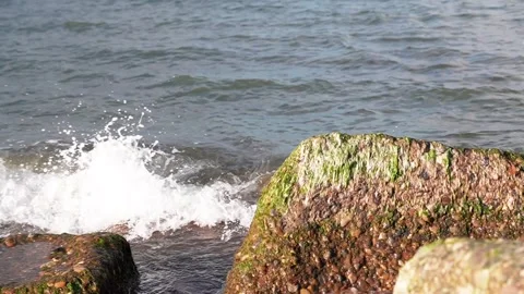 The waves beating against the stone, the pebbles are washed by waves on the sea Stock Footage 248314542