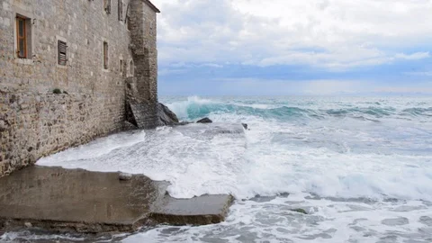 Waves beats against rocks and stone walls Stock Footage 122146496