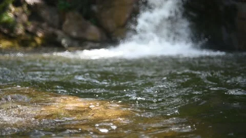 Waves on a beautiful pool of a waterfall in summer Stock-Footage 219383395