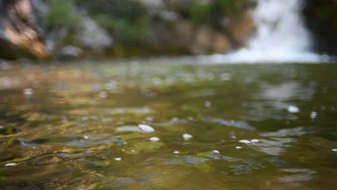 Waves on a beautiful pool of a waterfall in summer (bokeh) Stock-Footage 219418614