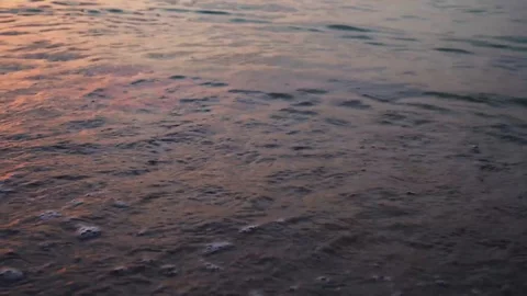 Waves on a beautiful sandy beach at sunset. Peace and harmony. Stock Footage 95035469