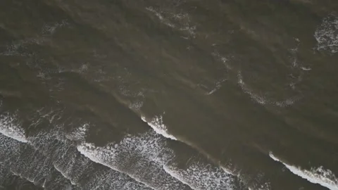 Waves Below: Sunset Aerial View from Above Stockbeeldmateriaal 308797768