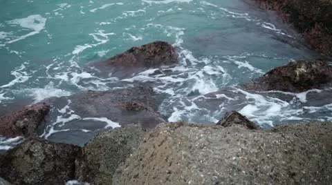 Waves between marine rocks Stock Footage 10593286
