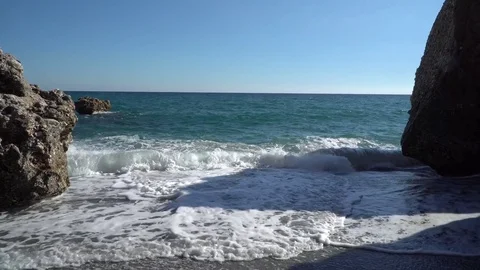 Waves between the rocks in Nerja, Spain Stock Footage 82581821