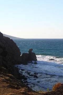 Waves between rocks Stock Photos