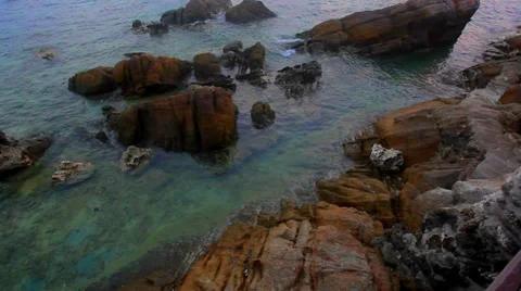 Waves between stones on coast in the evening Stock Footage 38686112