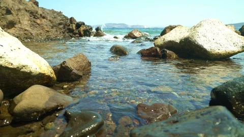 Waves between stones at sea Stockbeeldmateriaal 113455720