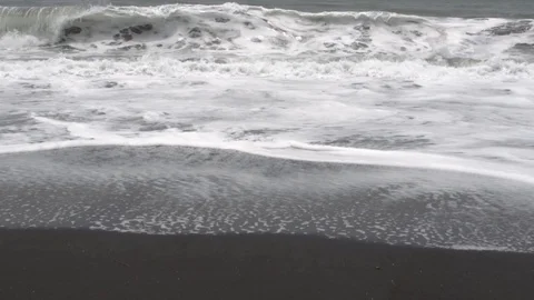 Waves on the black sand beach in Bali. Stock Footage 104132180